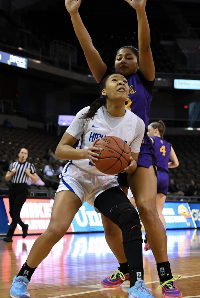 Aubrey Barret (12) fakes her defender to get an open layup. 